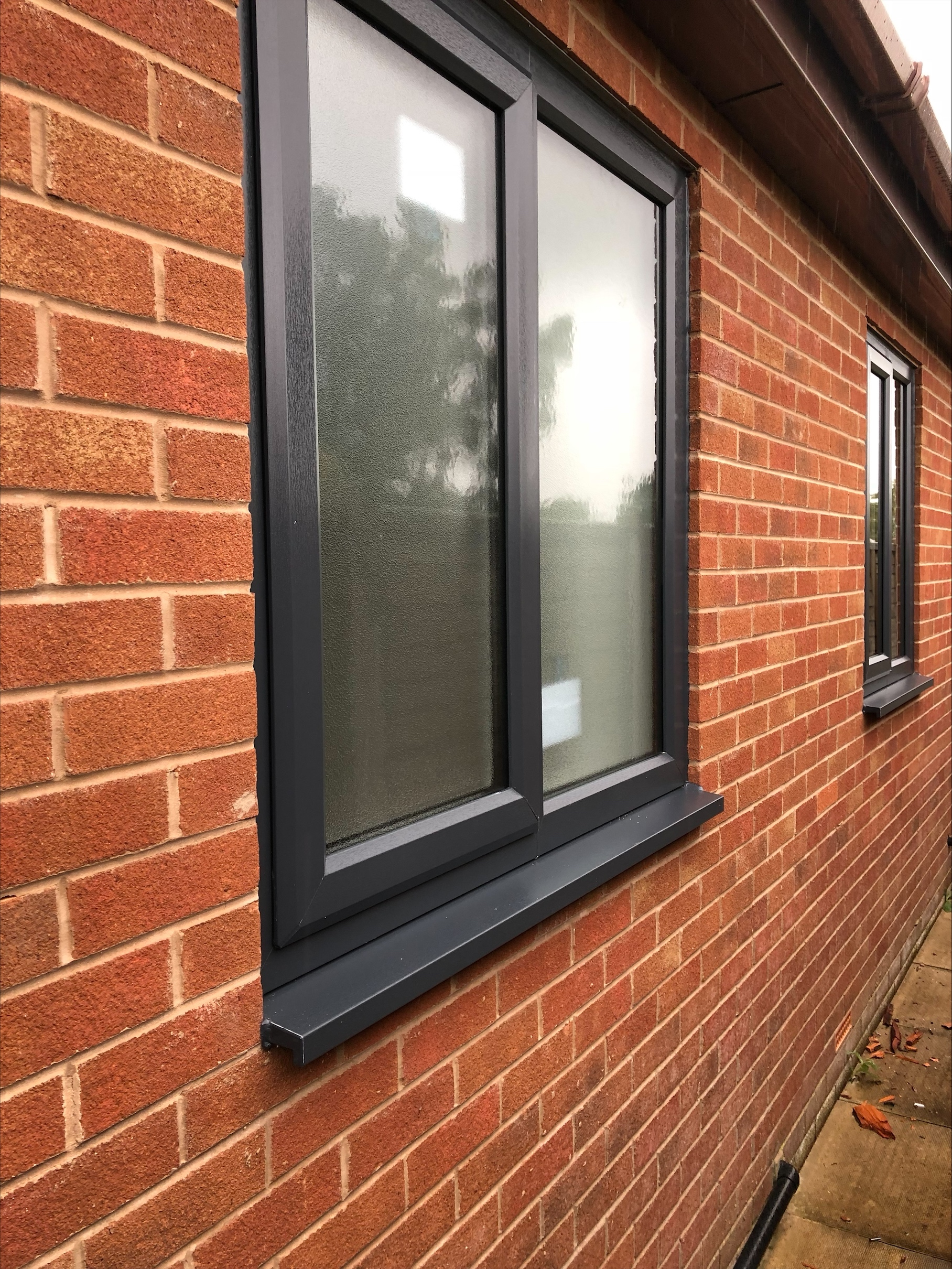Anthracite grey UPVC windows with frosted privacy glass