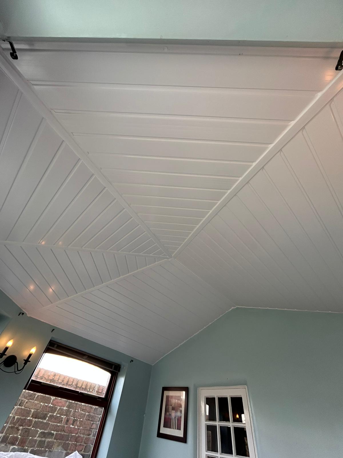 White conservatory interior ceiling with panel finish